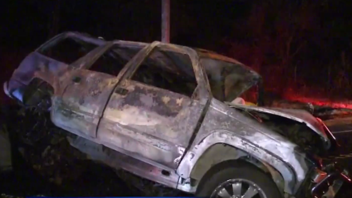 
An image from video shows an SUV after a head-on collision and fire on Highway 16.
