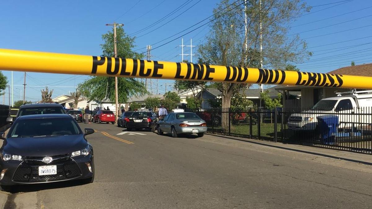 Police tape blocks 48th Avenue in south Sacramento on Sunday as officers investigate the fatal shooting of a man later identified as Dion Marcell Harris by the Sacramento County Coroner’s Office.