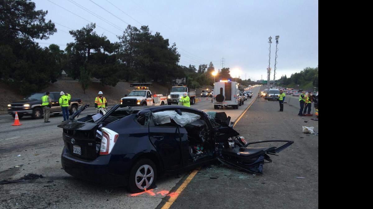 
The shattered Prius driven by a wrong-way driver blocks lanes on Highway 50 at the scene of the fatal crash Wednesday.
