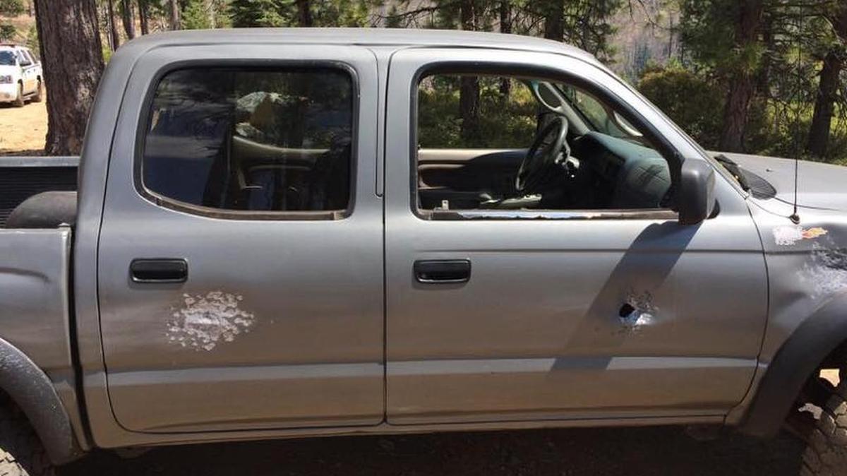 Shotgun blasts tore into the side of a hiker’s truck.