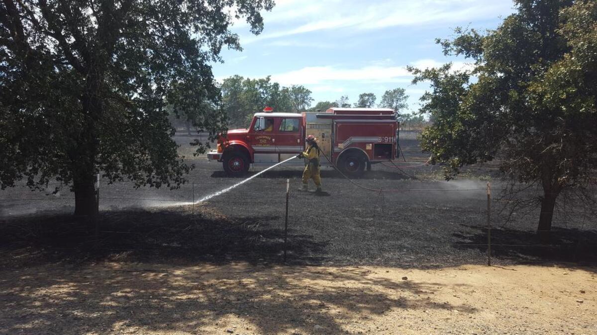 A firefighter controls hot spots after crews extinguished a 10-acre blaze in Sacramento County just west of the Valley Hi/North Laguna neighborhood. The Sacramento region is under a red flag warning this weekend due to dry conditions and high winds in the forecast. June 11, 2016