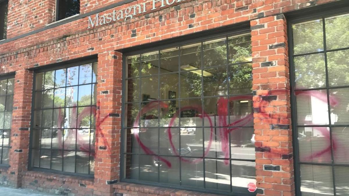 The Sacramento office of Mastagni Holstedt, a law firm that represents police officers, was struck by anti-police graffiti overnight. The first letter of the explicit phrase had been removed by Wednesday afternoon. July 12, 2017.