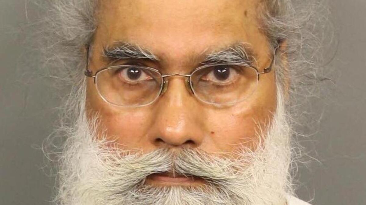 Narinder Singh Parhar was arrested Wednesday after being accused of inappropriately touching a female patient.