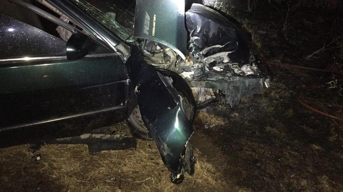 A badly damaged car sits in a field where it crashed on Sunday, June 18, 2017. The driver was pulled to safety by Lincoln police officers. The driver is suspected of driving under the influence.