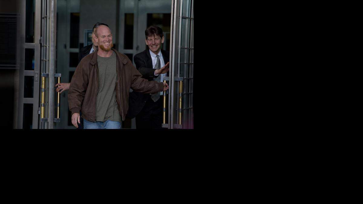 
Eric McDavid, 37, front, walks out of court a free man Thursday under an agreement with federal prosecutors. He was convicted in 2007 of conspiring to bomb Nimbus Dam and other area sites.
