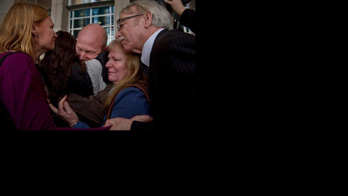 
Eileen and George McDavid, right, join in an embrace of their son Eric along with his sister Sarah McDavid, left, and girlfriend, Jenny Esquivel, outside the federal courthouse in Sacramento. A judge ordered Eric McDavid released Thursday after federal prosecutors agreed to a settlement and admitted that thousands of pages of evidence were withheld from the defense during McDavid’s original trial.
