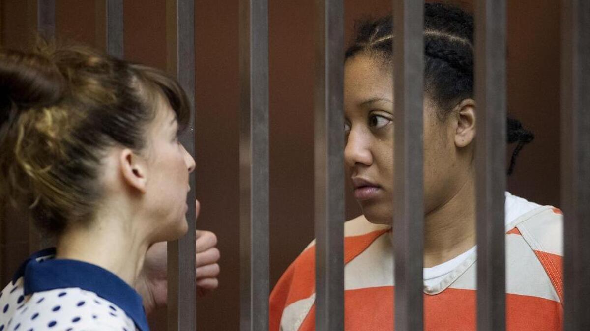 Defense attorney Amanda Reeves, left, with her client Porche Wright as she is arraigned in Sacramento Superior Court in Sacramento on Thursday, April 30, 2015. Wright is the Sacramento woman accused of setting fire to her 7-year-old daughter.