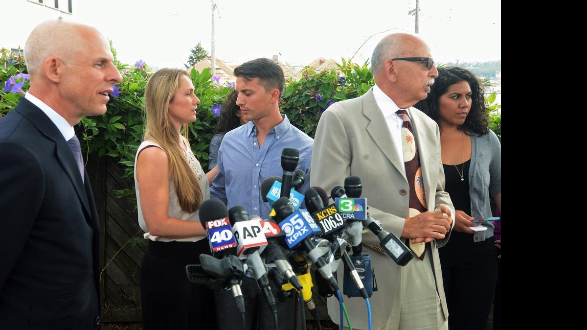 
Denise Huskins and her boyfriend, Aaron Quinn, turn to each other at the end of a news conference on Monday in Vallejo. At left is Huskins’ attorney, Douglas Rappaport, and second from right is Quinn’s attorney, Daniel Russo. The lawyers for a couple in a kidnap-for-ransom case that police called a hoax are blasting investigators and asking that authorities set the record straight. Russo said Vallejo police detectives rushed to judgment and that he and Rappaport want the public perception of their clients changed. 
