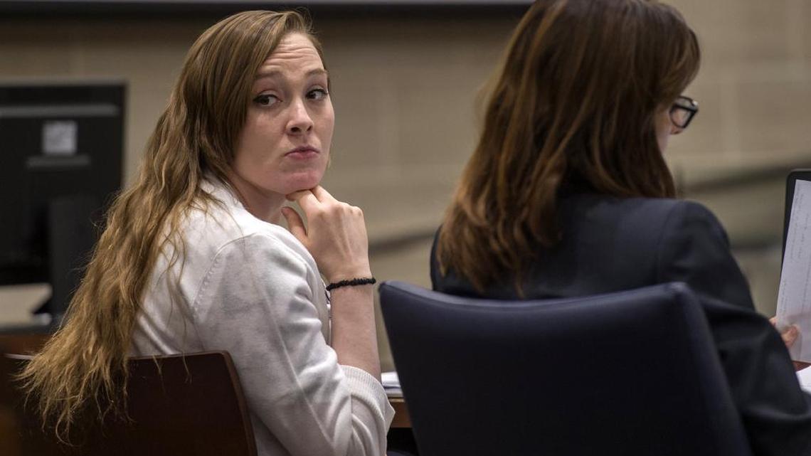 Samantha Green, left, charged with second-degree murder in the death of her infant son, Justice Rees, looks back into the Yolo Superior Court gallery after a day listening to testimony Monday in Woodland.