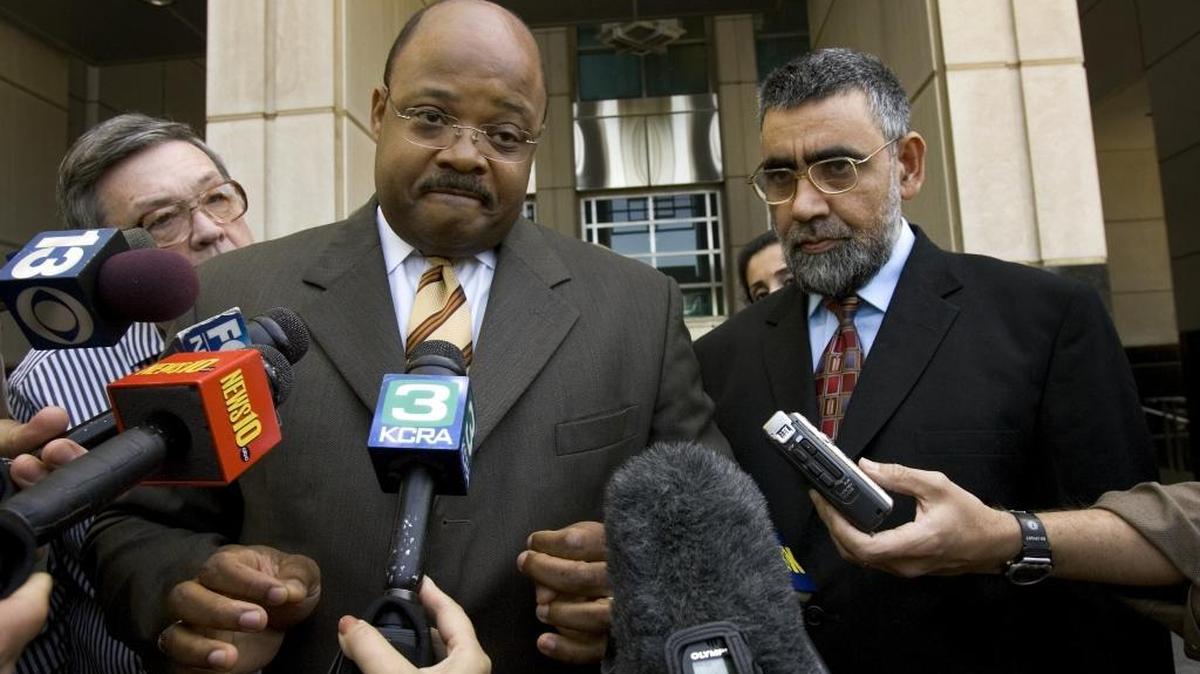 Umer Hayat, right, is released from the federal courthouse in Sacramento on Monday May 1, 2006. He is shown with his attorney Johnny Griffin III.