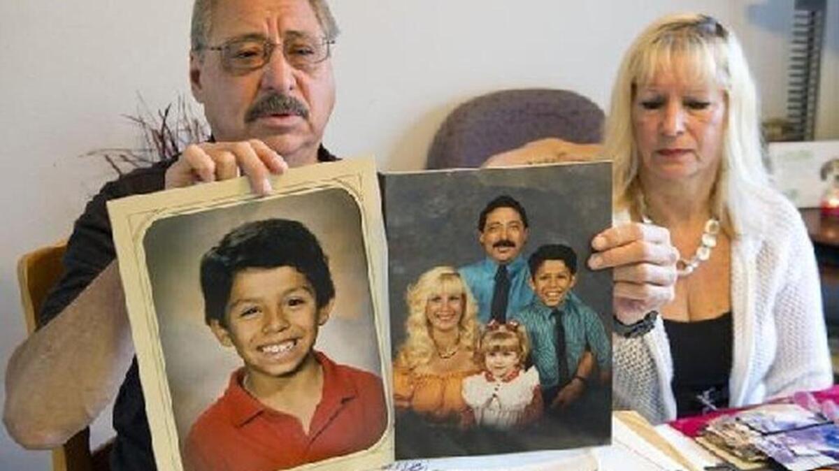 Steve and Elaine Duran show off family photo albums of son Joseph Duran in their Whittier home in January 2014.
