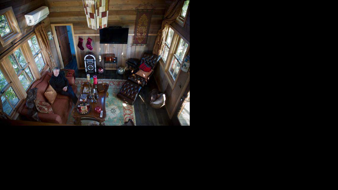 
Mike Splinter sits in the living room of his Granite Bay treehouse on Tuesday. The treehouse was recently featured in the television show “Treehouse Masters,” where an expert builder constructs a treehouse at someone’s home.
