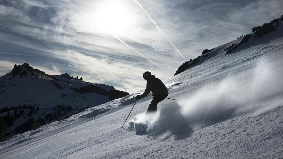 A skier takes to the slopes at Kirkwood Mountain Resort in 2017. The resort agreed to pay a $754,732 fine over violations of the federal Clean Water Act.