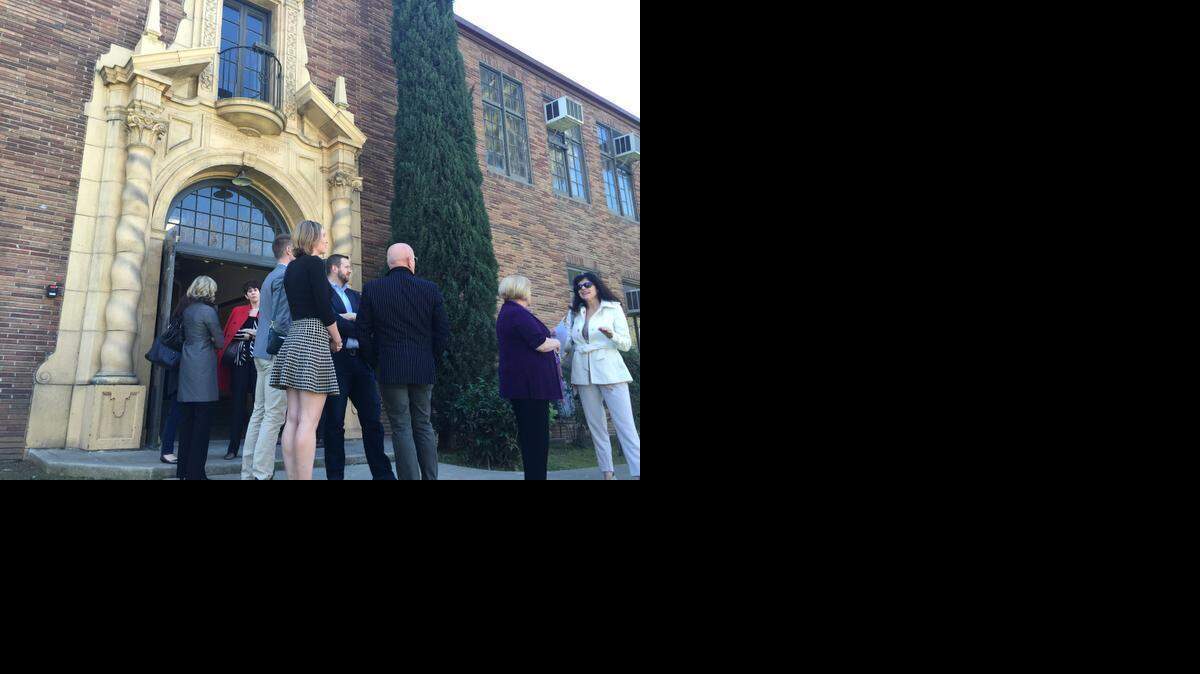 
Supporters of the new arts center at the Fremont Adilt School gather outside the building on Thursday.

