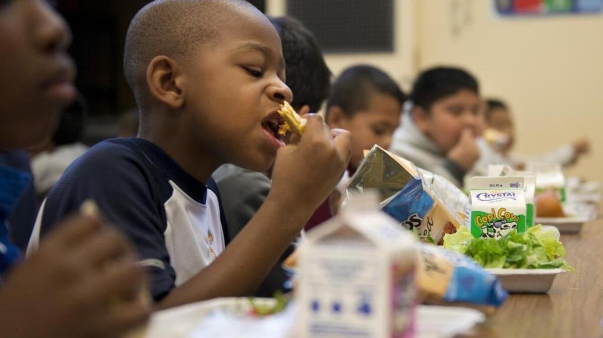 Jacob Anderson, 7, eats lunch at Oakridge Elementary School on Sept. 29, 2015. The Sacramento City Unified School District bought tens of thousands of dollars in canned peaches, pears and applesauce from China, defying a federal guideline that asks U.S. schools to serve domestic food and running counter to the district’s embrace of the local farm-to-fork movement.