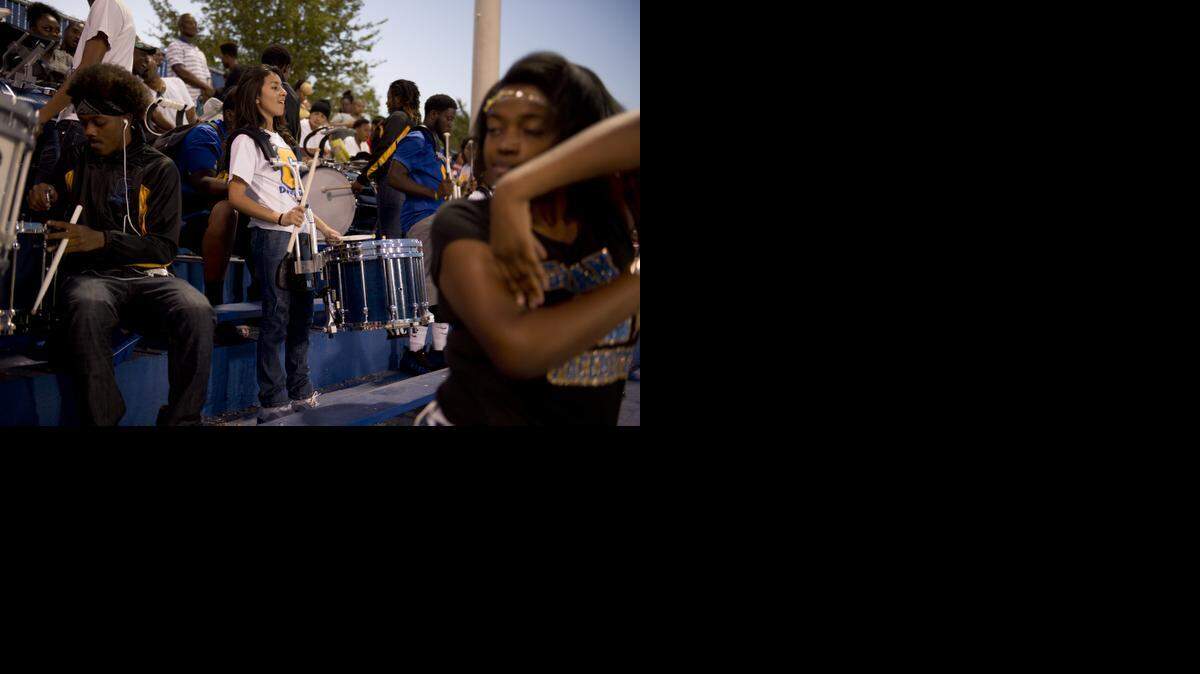 
Sophmor Stephanie Romero, 14, plays with the drum line during the Grant High School football game at Grant High School.
