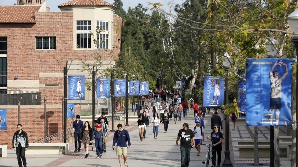 In this Feb. 26, 2015 file photo, students walk on the UCLA campus in Los Angeles.