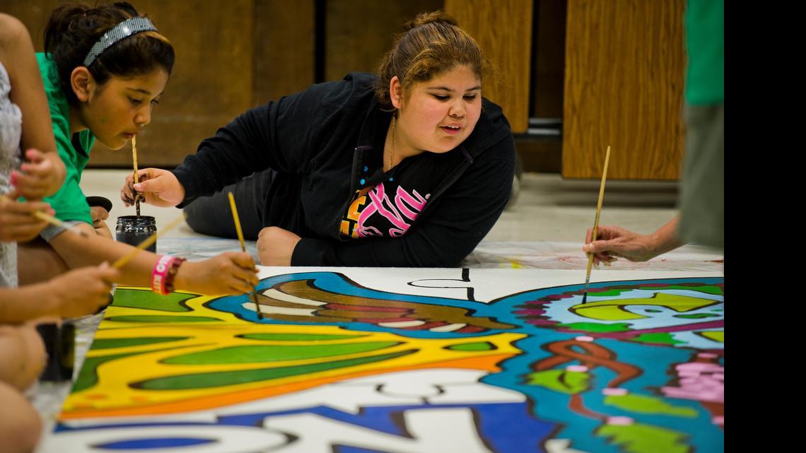
Andrea Ramirez, 12, graduated from Washington Elementary School and was one of many volunteers helping paint a mural there before the school was shut down in 2013. Half of the mural went to William Land Elementary and the other half went to Theodore Judah Elementary, the two schools to which Washington students were reassigned.
