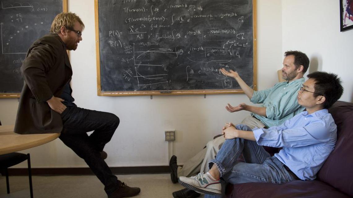 
UC Davis grad students Brent Follin, at left, and Zhen Pan, right, meet with physics professor Lloyd Knox. They have teamed up to glean more information about the Big Bang. They meet weekly to work on research into neutrinos and other items that physicists use to research the Big Bang, how it happened, when and why.
