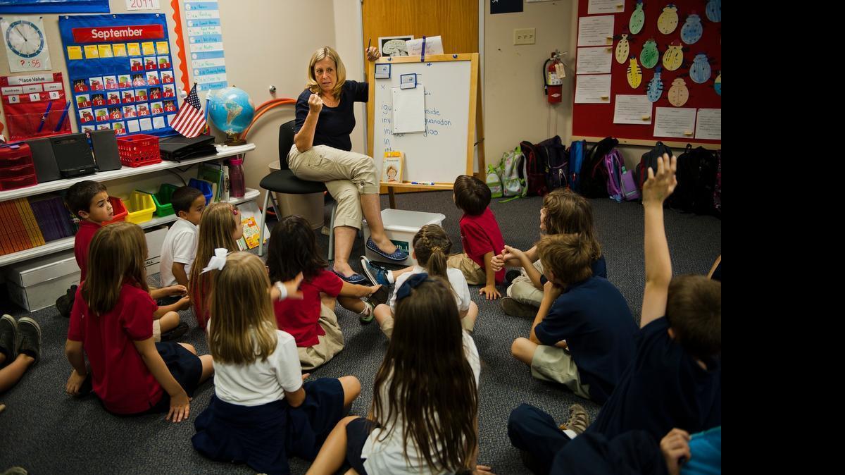 
Betsy Stenklyft teaches second grade at John Adams Academy shortly after the school’s opening in 2011. She was a 30-year veteran teacher in Roseville and loved the school so much she came out of retirement to teach there. 
