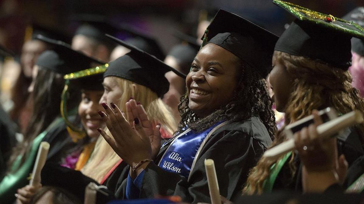 Student Alia Wilson reacts as she graduates with a Bachelor of Science degree in Biology during commencement ceremonies at Sleep Train Arena in Sacramento on Saturday, December 19, 2015. Sac State held its winter commencement ceremonies at Sleep Train Arena with 3,578 graduates.