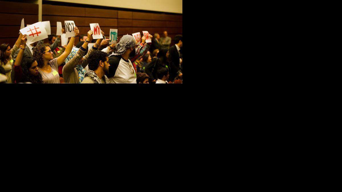 
Students hold up signs spelling out “#NOTMYSTUDENTREGENT” after Abraham “Avi” Oved was confirmed as a student member of the UC Board of Regents at the board’s meeting July 16 in San Francisco. Protesters said Oved had improper financial connections to pro-Israel groups.
