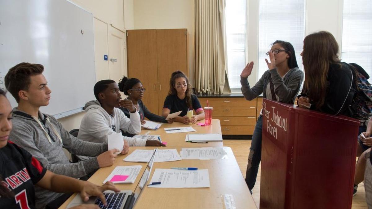 On a recent Thursday, Janae Carter, second from right, and Daryn Nieto, right, explain why they were listening to music on their phones in class. Every Thursday, a peer judicial panel of students at San Juan High School sit in judgment on fellow students who have broken campus rules. Justice is dispensed with an apology to the wronged party or an essay saying they won't repeat the offense. The practice is gaining strength around the nation and is popularly known as "restorative justice." Students on the panel are, from left, Quezisha Conner, Tristan Bare, Robert McCormick, Noelle Nixon and Ellina Hromava.