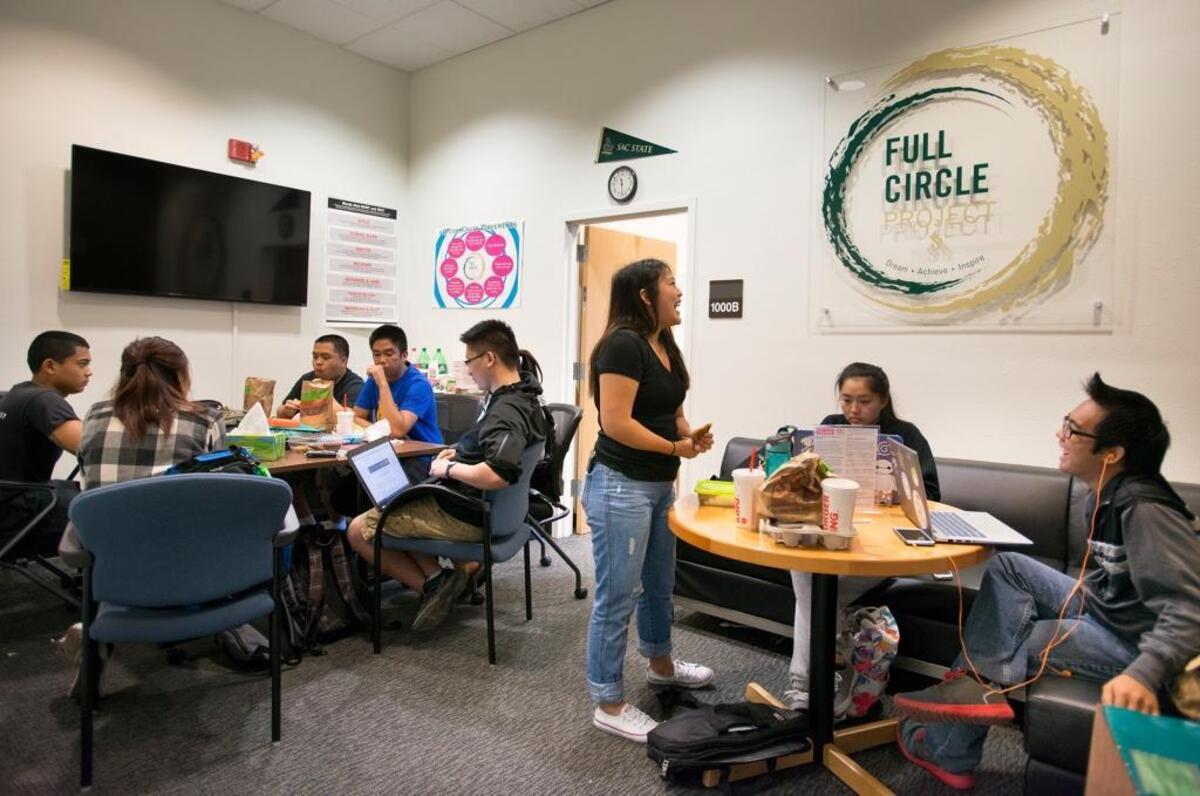 Students study, eat lunch and talk inside the Full Circle Project office on the Sacramento State campus on Monday.