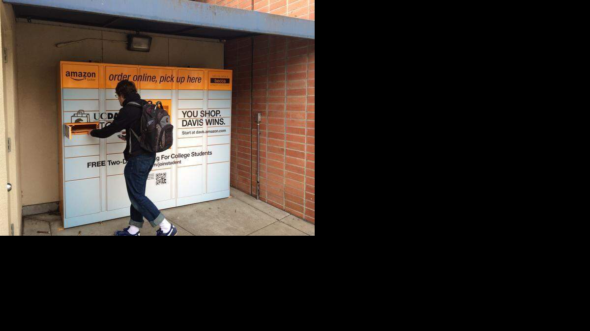 
Nick Toothman, 26, retrieves a purchase from an Amazon.com locker recently installed at UC Davis. “I knew I was going to be here,” he said. “It’s really easy.”
