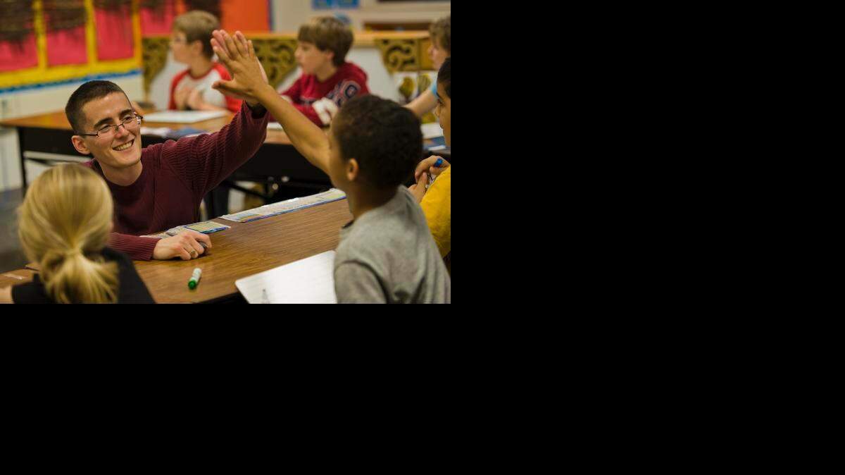
In this file photo from 2011, Josh Costa, left, celebrates the right answer to a math question with Gabriel Williams, then 9, in his third grade class at Sierra Oaks K-8 School in the San Juan Unified School District. Sierra Oaks is one of 11 district schools testing a new report card that measures attributes such as grit and gratitude in addition to academic skills. Photo taken March 15, 2011.
