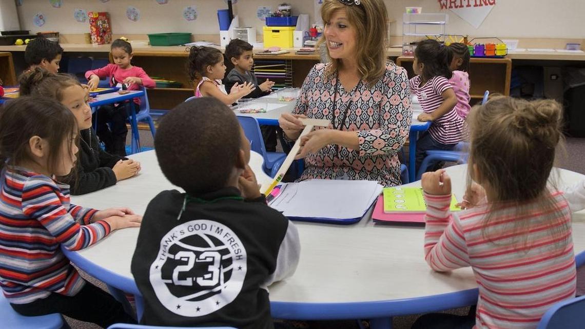 Teacher’s aide Heidi Ochoa works with preschool students at Natomas Park Elementary School in Sacramento on Tuesday, Oct. 4, 2016. New state funds allowed Natomas Unified to double the number of half-day preschool classes from four to eight, for a total of 100 new seats, district spokesman Jim Sanders said.
