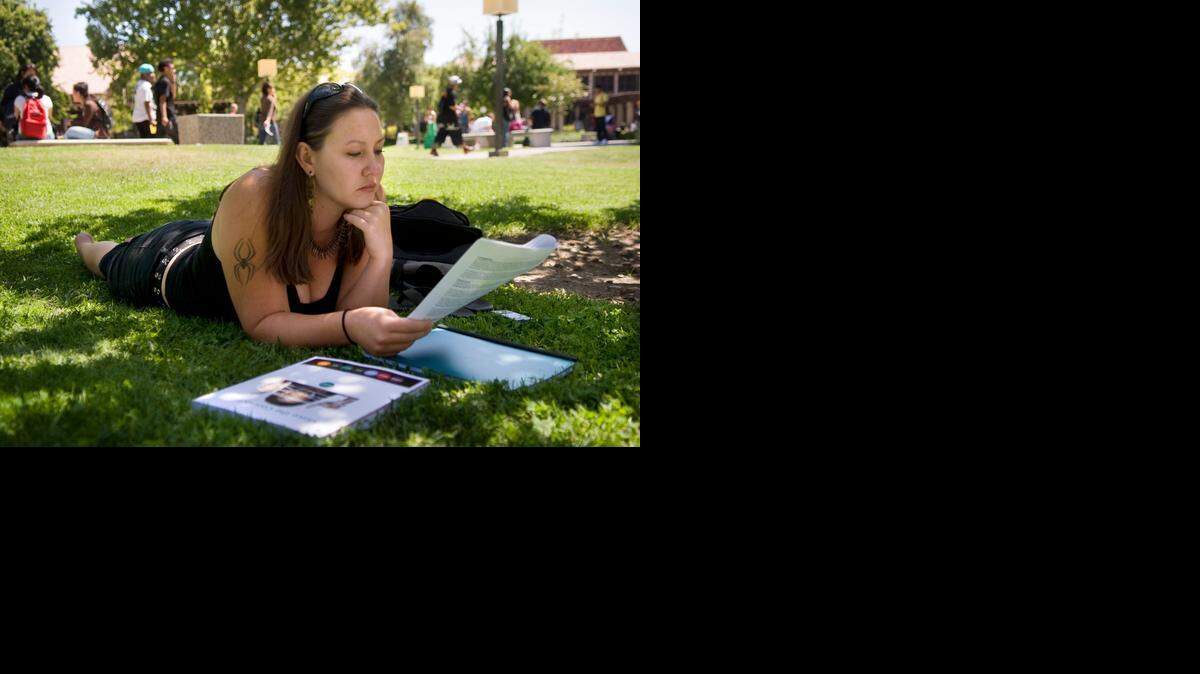 
Holly Gibson of Sacramento reviews the syllabus for her new psychology class on the first day of school at Sacramento City College in August  2009.
