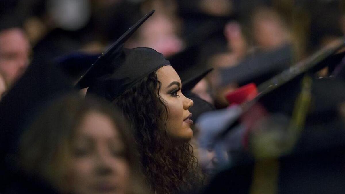 Alexis Griffin joins her fellow CSUS grads Friday at Sleep Train Arena. Her biggest motivator as a student, she says, was her son Noah, now 2 years old.
