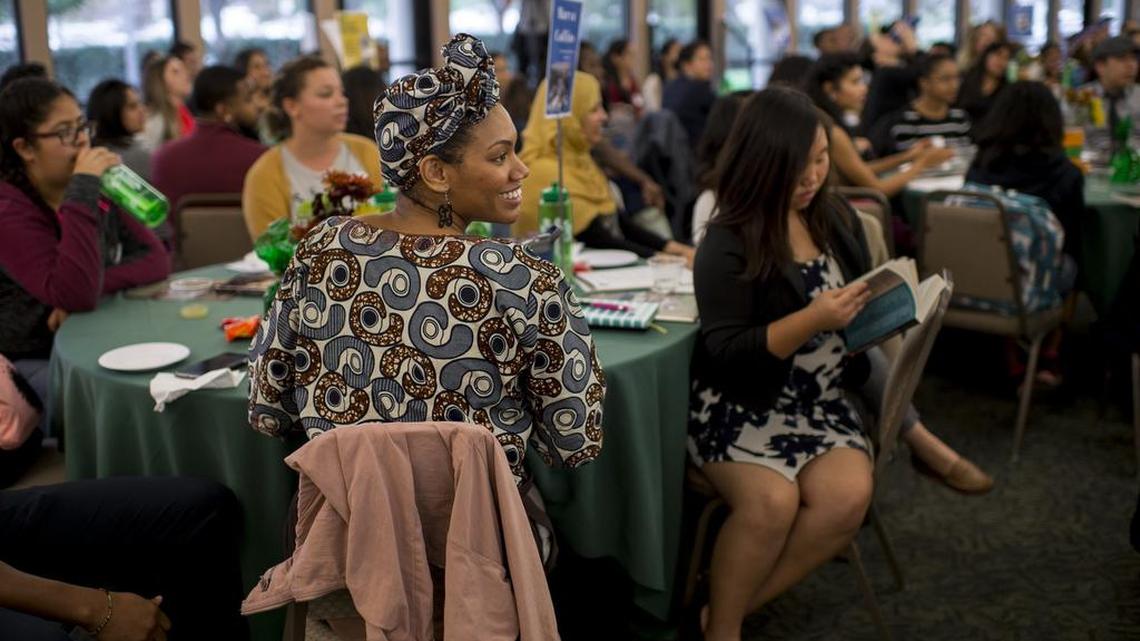 Dominique Williams, an English and ethnic studies teacher at Burbank High School, listens to speakers at a teacher-recruitment seminar at Sacramento State on Thursday. CSUS is trying to help solve the teacher shortage by recruiting students in other majors.