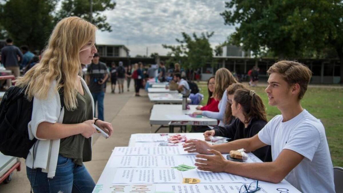 Hannah Dadigan, 16, listens to Nils Patrick, a senior at Rio Americano High School, Thursday, Oct. 13, 2016, discuss the pros and cons of fiscal sponsorship for the school’s Civitas program, a four-year academic and community leadership program. Rio Americano High School’s civics program is known as a model throughout the state. The school is an example of what the state requires from new civics framework.