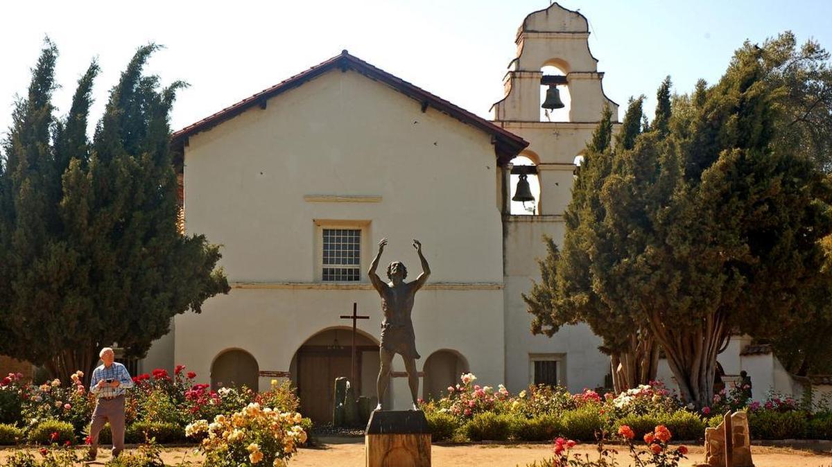 The garden is filled with roses at Mission San Juan Bautista, which was founded in 1797.
