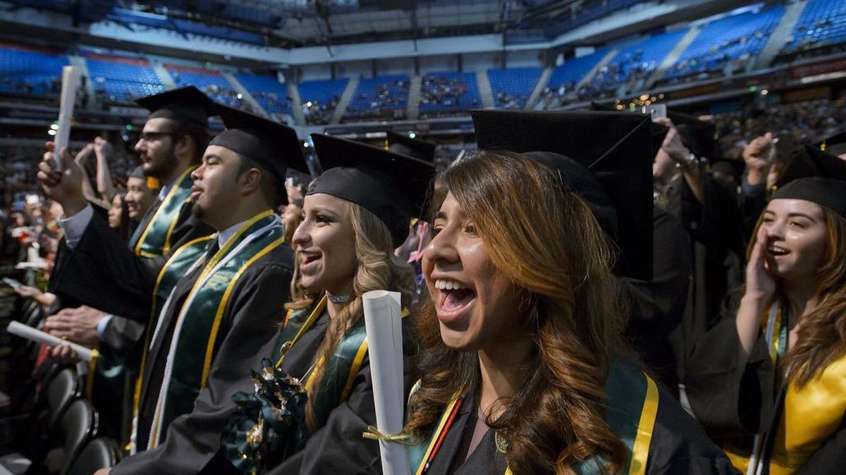 Graduates, including psychology major Ruth Chun Reyes, center, celebrate during the Sac State graduation ceremony at Sleep Train Arena in Sacramento on Friday, December 16, 2016. This year’s graduation ceremonies, scheduled for today and tomorrow, are the last scheduled events to be held at Sleep Train Arena