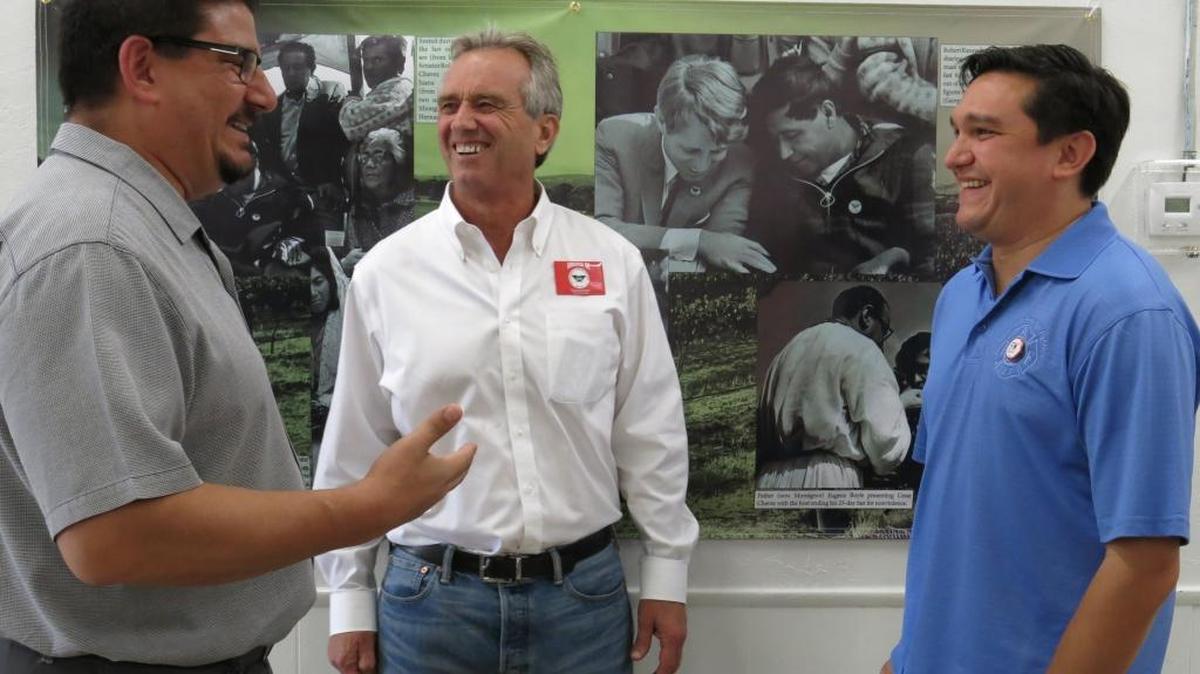 
From left, Sacramento County Supervisor Phil Serna, Robert F. Kennedy Jr. and Fabrizio Sasso, head of the Sacramento Central Labor Council, talk Saturday, Sept. 26, 2015, at the celebration of the 50th anniversary of the Delano grape strike. Behind them is a photo exhibit showing Kennedy’s father, Sen. Robert F. Kennedy, meeting with labor organizer Cesar Chavez.
