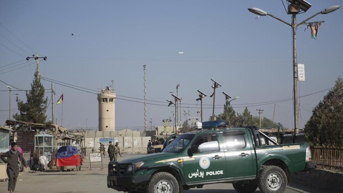 Afghanistan’s National Army and police soldiers guard, blocking the main road to the Bagram Airfield’s main gate in Bagram, north of Kabul, Afghanistan, Saturday, Nov. 12, 2016. An explosion at the U.S. airfield early Saturday killed four people, the head of international forces in the country said.
