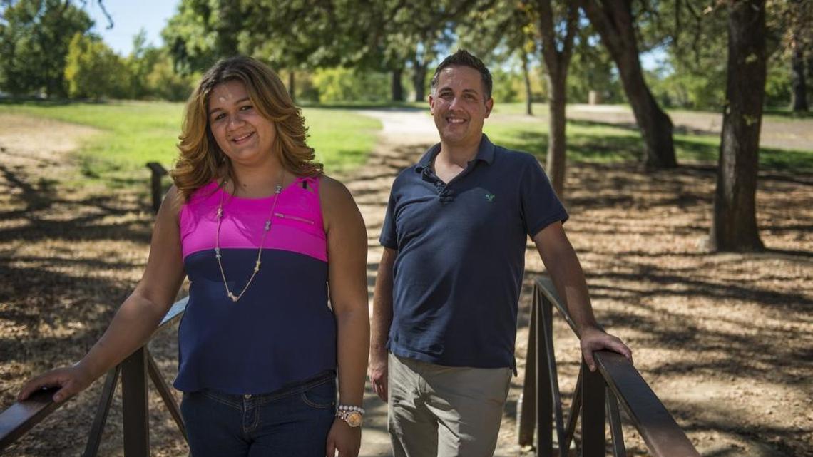 Erica Dukes, 17, poses with her dad, Scott Dukes, for a portrait at the Foothill Community Park on Thursday, Aug. 25, 2016, in Sacramento, Calif. Erica, who is transgender, was adopted by Scott in 2013 after being her foster parent for over a year.
