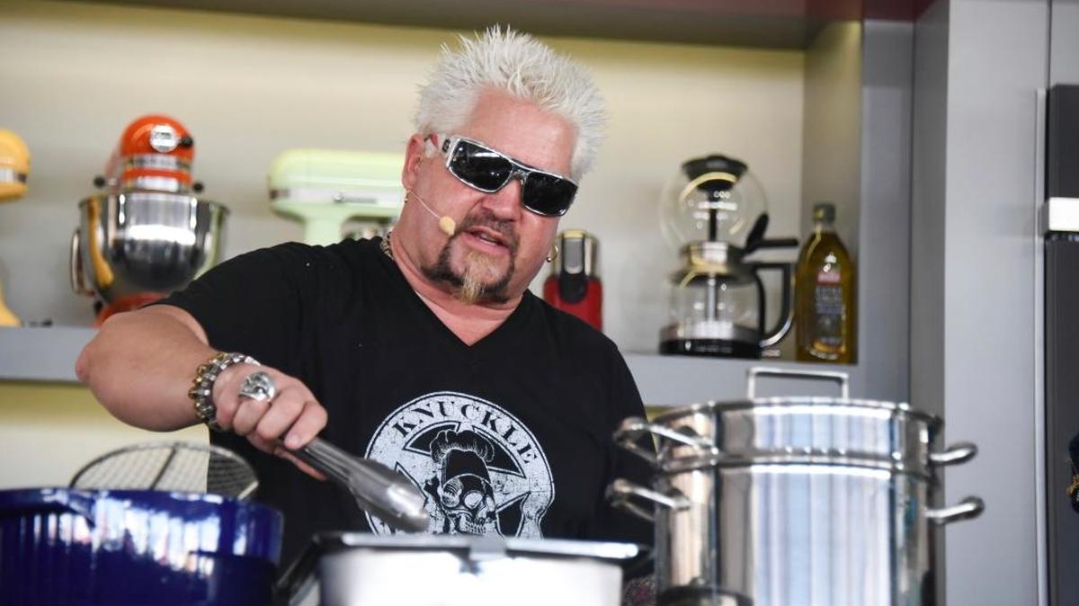 Guy Fieri hosts the South Beach Wine & Food Festival - Goya Foods' Grand Tasting Village KitchenAid Culinary Demonstration on 13th Street & Ocean Drive on Feb. 25, 2017, in Miami Beach, Fla.