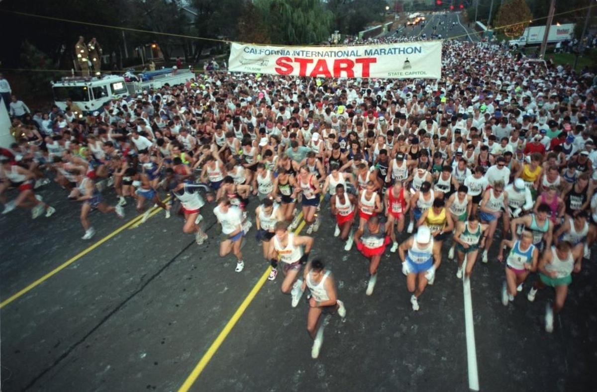 At 7 a.m. sharp, runners leave the start line during the California International Marathon in 1995 on Auburn-Folsom Road near Folsom Dam.