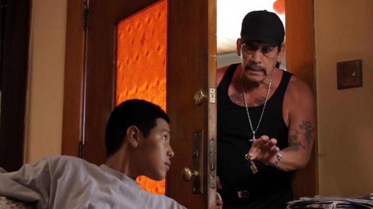 Danny Trejo, right, and breakout artist Johnny Ortiz in a scene from “Strike One.”