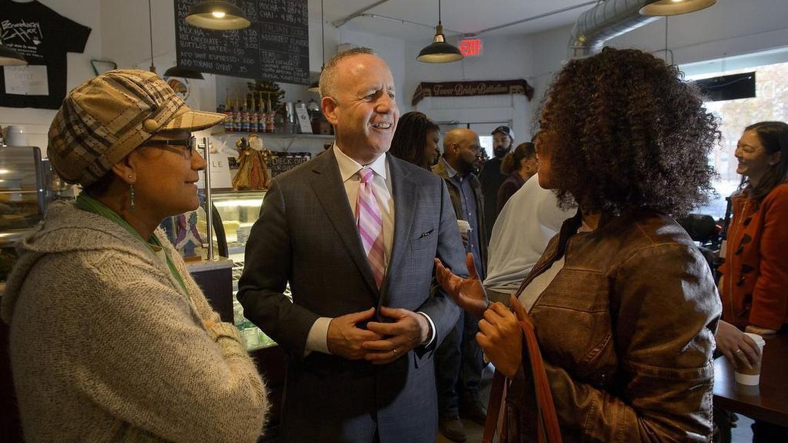 Sacramento Mayor Darrell Steinberg greets Elvia Vasquez, left, and Helen Berhane, right, at Broadway Coffee in Oak Park on Wednesday, December 14, 2016. Mayor Steinberg spent his first day in office touring Oak Park.