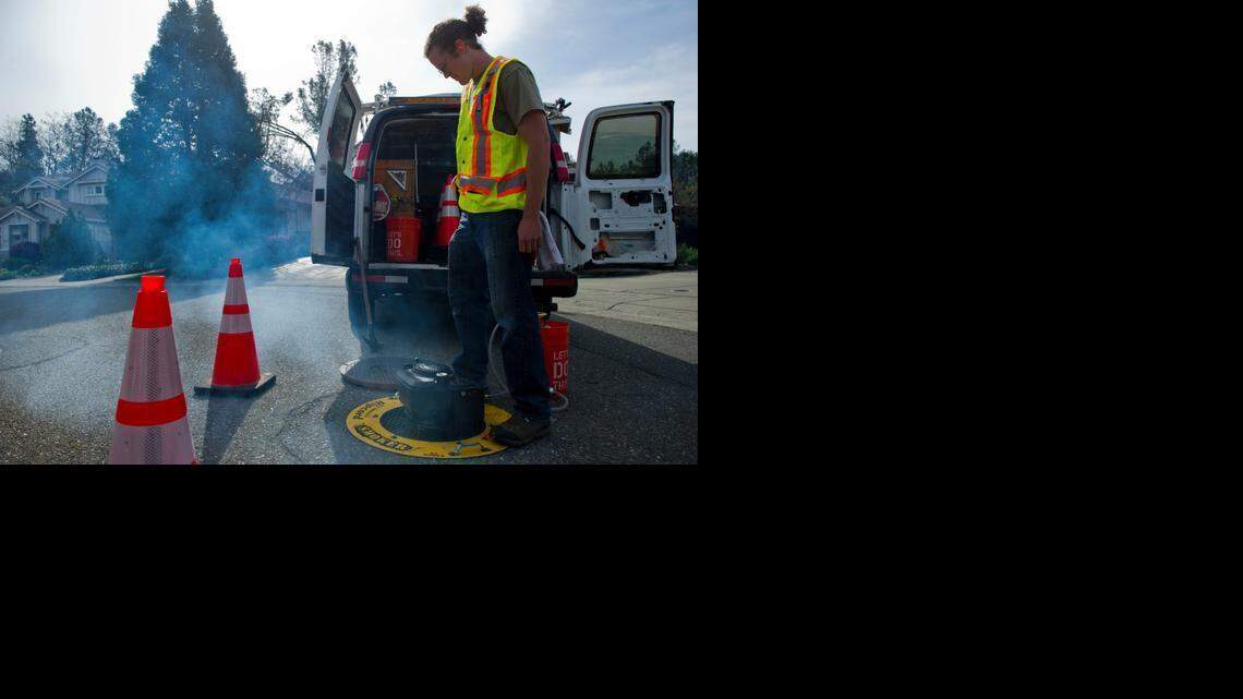 
Sam Lisson, a field service technician with SFE Global, works with Folsom city workers to smoke-test a sewer system.
