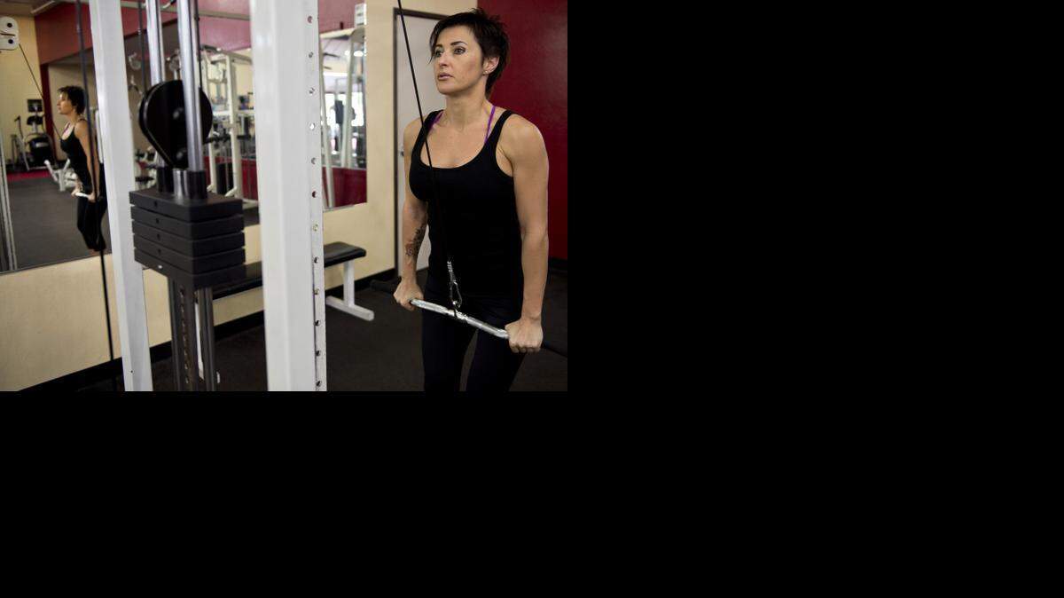 
Irina Proshak, 41, works out Sunday at The Gym in Sacramento. She won an international bodybuilding competition in San Diego last month.
