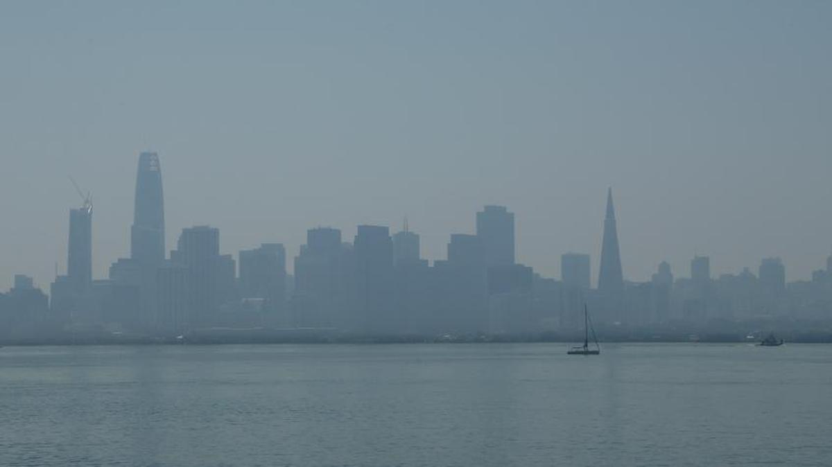 Haze over the San Francisco skyline is seen Friday, Sept. 1, 2017, from Treasure Island, San Francisco. Dozens of cooling centers opened throughout California, schools let students out early and outdoor events were canceled as temperatures soared from a heat wave expected to last through the Labor Day weekend.