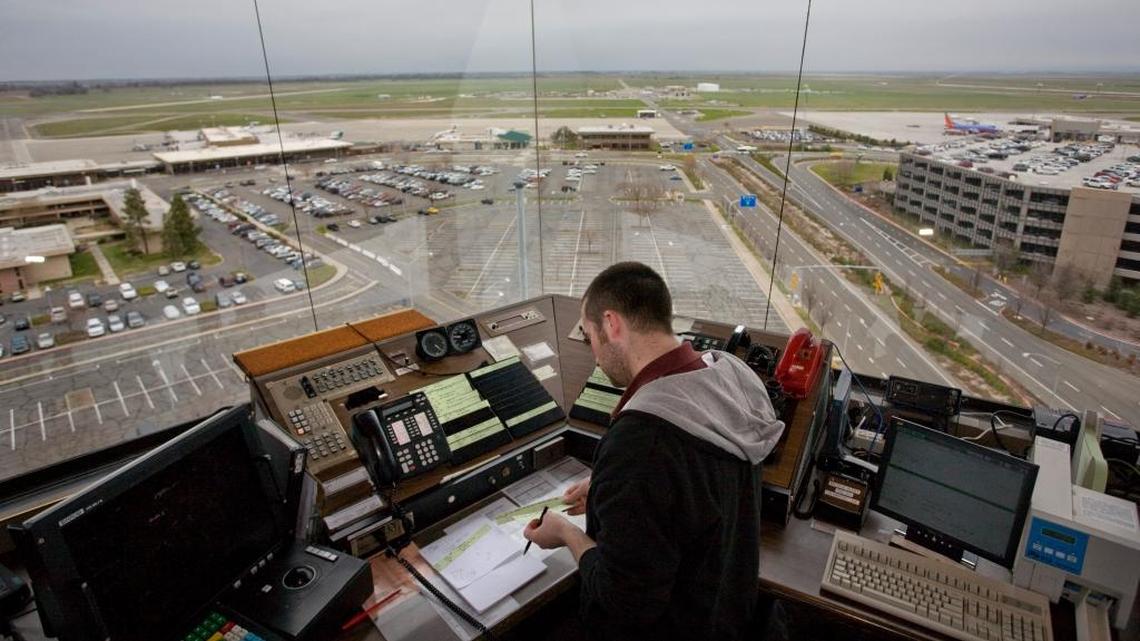 Air controller Tyler Casper controls the taxi ways from the 150-foot control tower in 2008. Last week’s mid-air collision highlighted the air traffic controller shortage but FAA documents show Sacramento’s staffing is above its “staffing standards target.”
