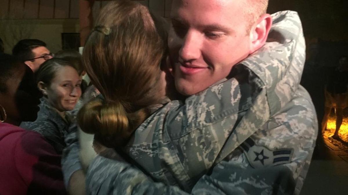 
Air Force medic Spencer Stone, 22, hugs a well-wisher after he landed Thursday night at Travis Air Force Base.
