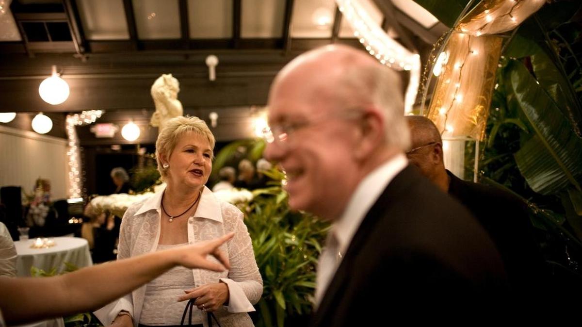 Sacramento County Supervisor Roberta MacGlashan, left, and her husband, Craig, foreground, chat with friends in 2007 during the “Fall Ball at City Hall,” celebrating Citrus Heights’ 10-year anniversary as a city.